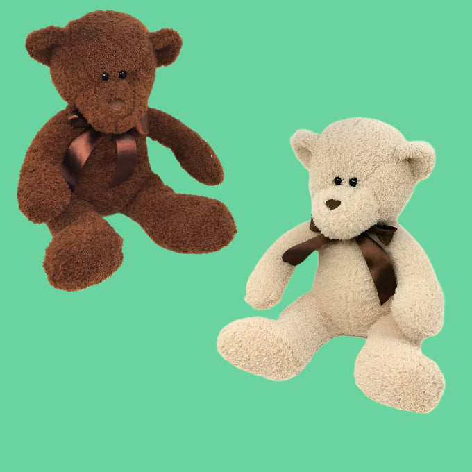 Two plush teddy bears, one in dark brown and one in light brown, each with dark brown ribbon around their necks.