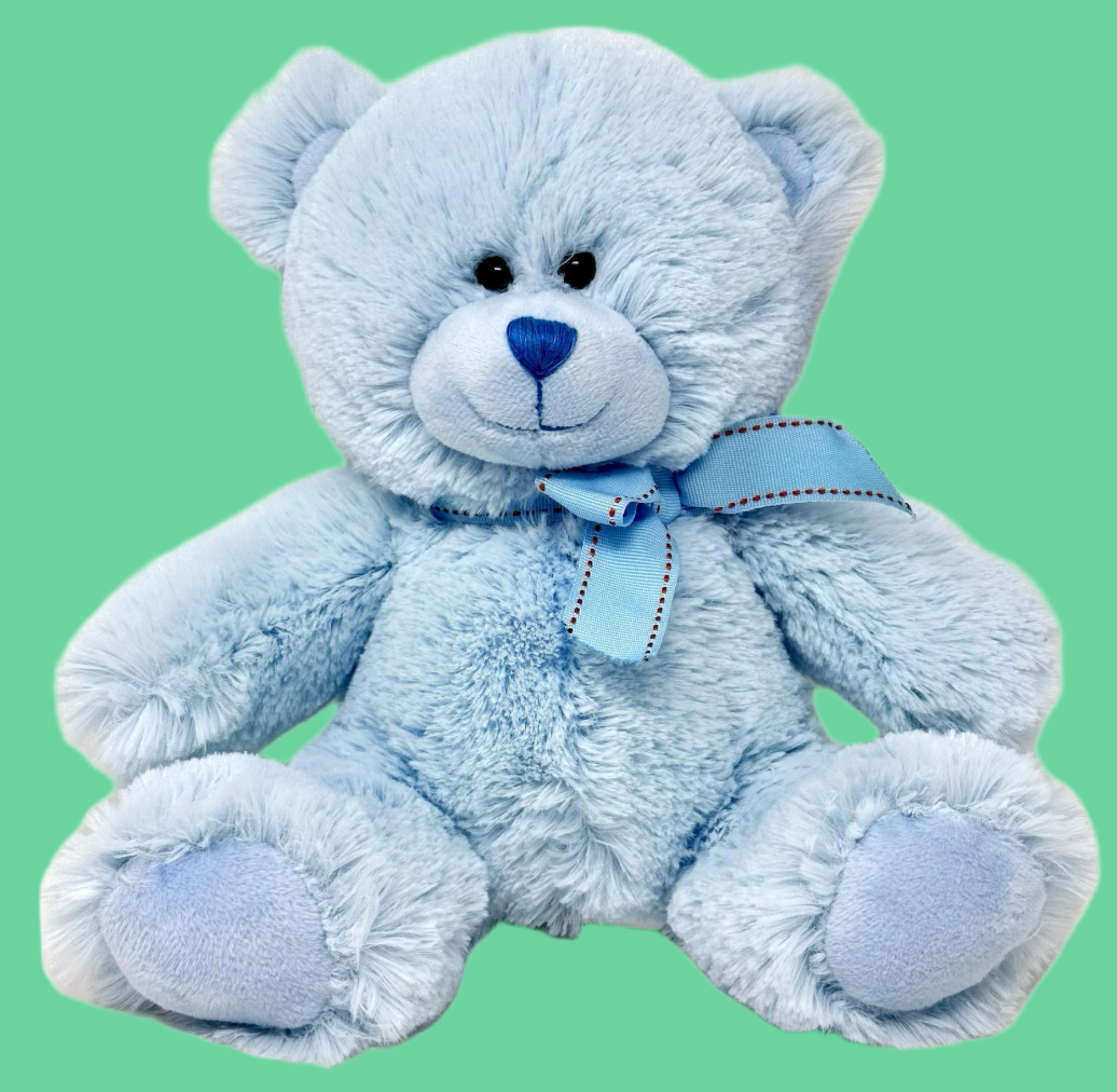 A plush blue teddy bear with a blue ribbon around its neck.