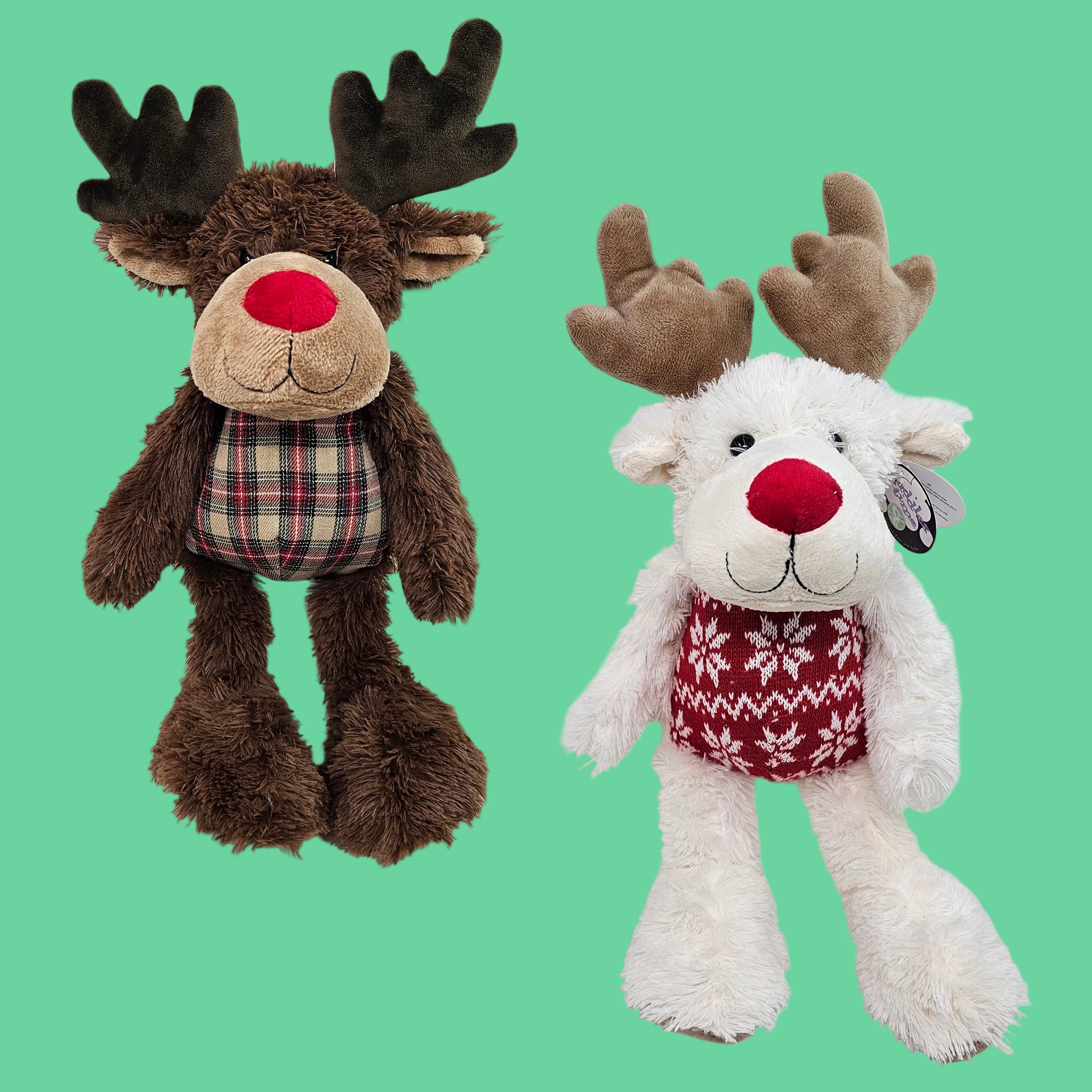 Two plush toys, one brown moose and one white reindeer, on a light green background.